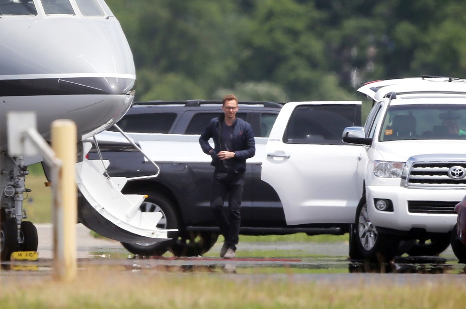  Tom looked dapper as he followed his new girlfriend onboard