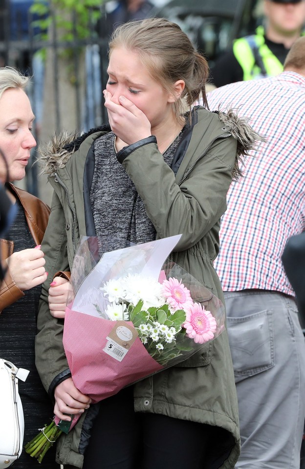 Tearful Emma Warrillow lays flowers in memory of her friend Mrs Cox and leaves touching message in tribute to her