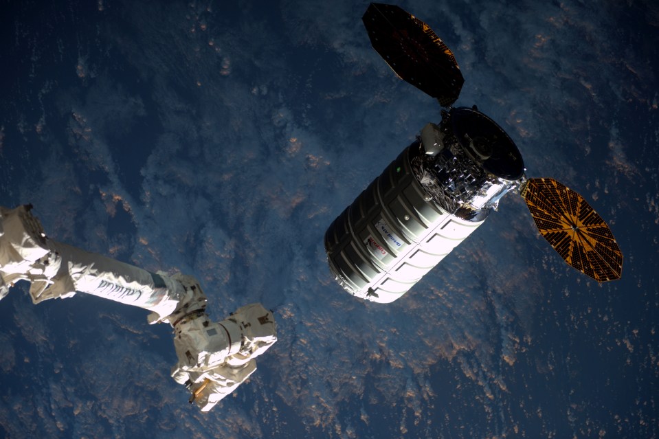 A robotic arm on the ISS, called the Canadarm, was used to snag this supply craft as it shot towards them