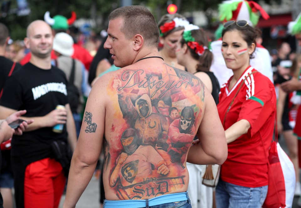  Some fans wore elaborate designs such as the masked hooligans on the back of this Hungary supporter