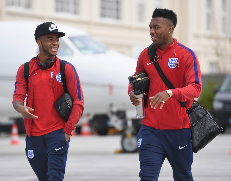 Raheem Sterling and Daniel Sturridge chat as they arrive in St Etienne