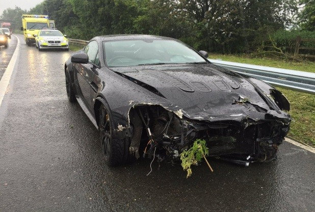  The Aston Martin V12 Vantage was pictured smashed up at the side of the motorway. Police confirmed the driver was a former F1 ace