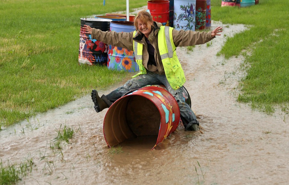  After a torrential downpour on Friday fields were sodden with water, but one person helping to set up the site made the best of the situation