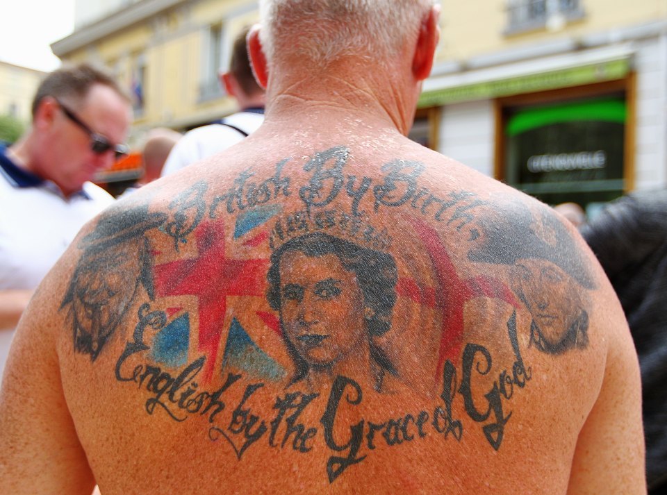  Proud Englishman shows off inkings of the Queen, Churchill and Nelson ahead of Monday's game against Slovakia in Saint-Etienne