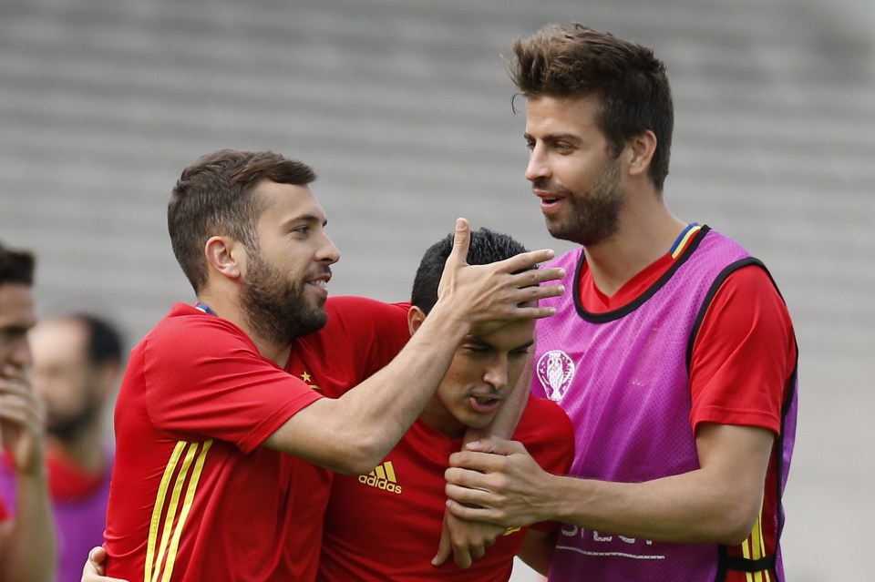 Jordi Alba and Gerard Pique try to lifts Pedro's spirits at Spain training