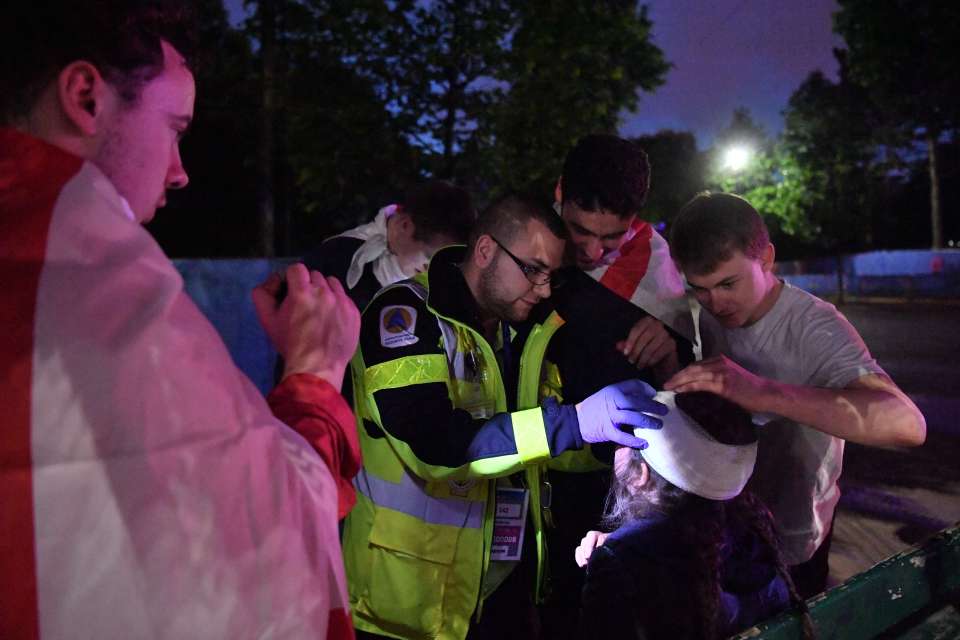 A civil security agent makes a band aid