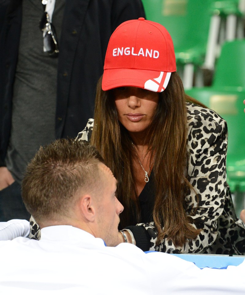 Jamie Vardy speaks with his wife Rebekah after England's draw with Slovakia