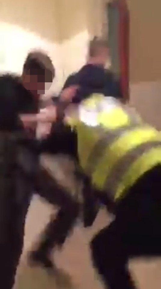 The teenagers grab and punch the policeman