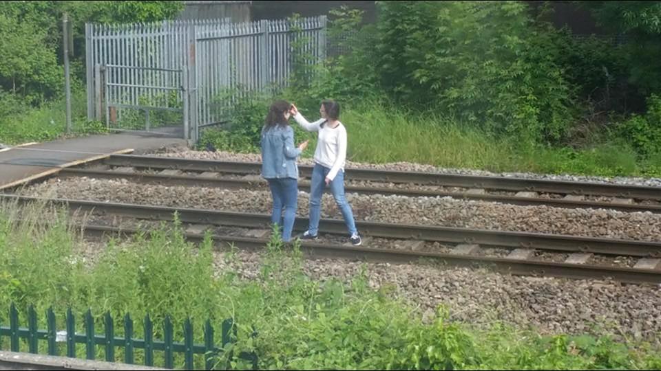  Parents have been warned to keep their children off the tracks during the summer holidays after two teenagers are spotted taking selfies on a busy train line in Wales