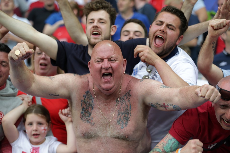  A patriotic English fan cheers on the Three Lions against Slovakia in Saint-Etienne