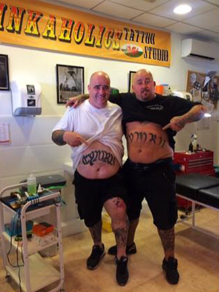  Mark Jones, left in the white t-shirt, had a new tattoo done to celebrate Wales coming top of Group B