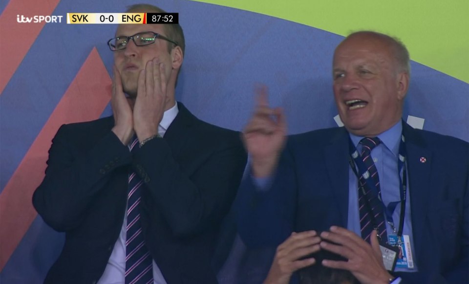 Prince William holds his head in his hands after Harry Kane missed a late chance against Slovakia as Greg Dyke gets animated