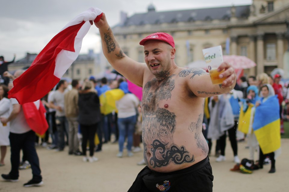  A shirtless Poland fan celebrates victory over Ukraine in the Fan Zone