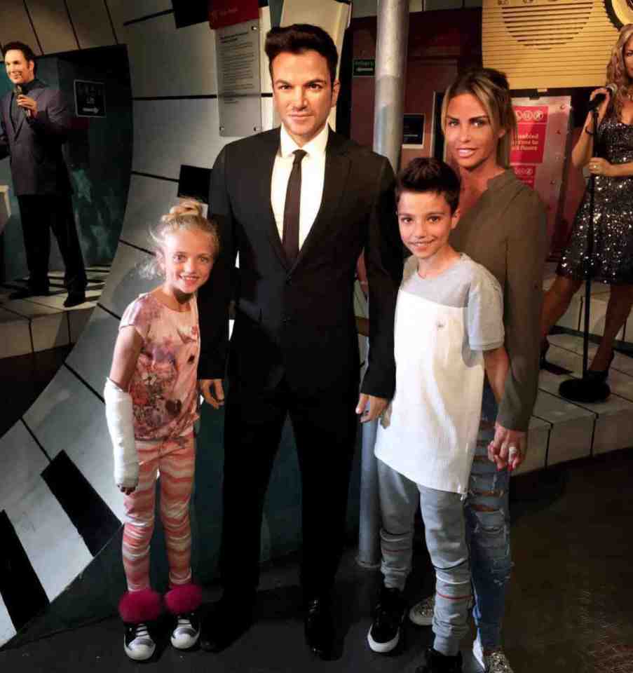 Katie, Princess and Junior had a photo with a waxwork of their dad 