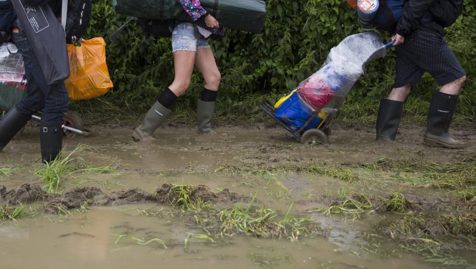  The campsite is already fairly waterlogged and the grass fields have been churned up into muddy pathways - and it is only day one