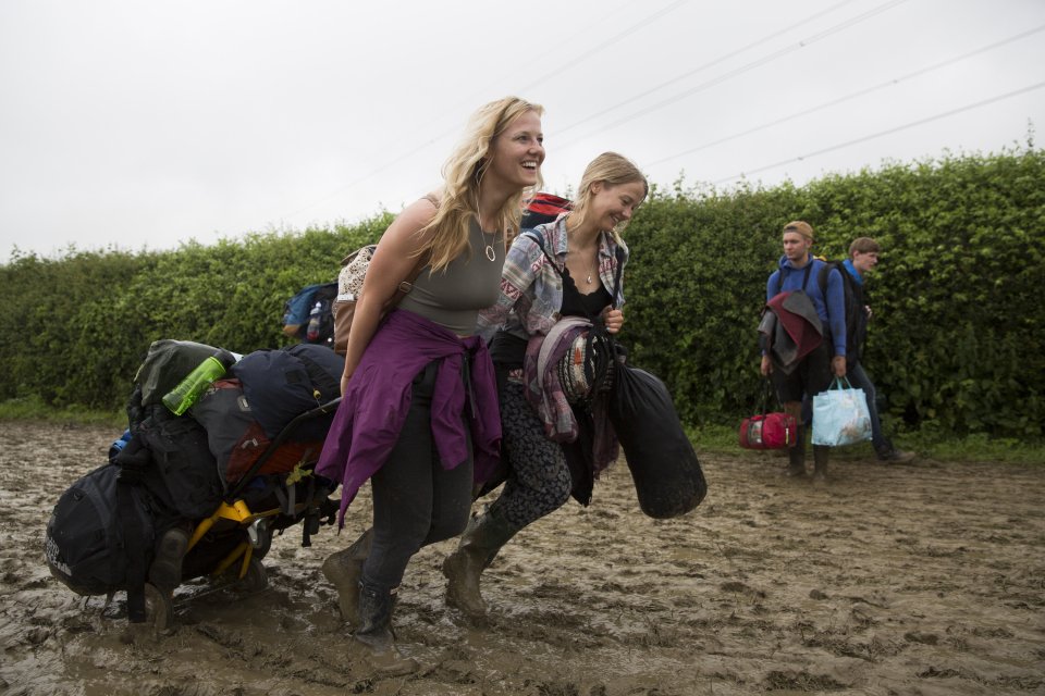  Two friends wade through the mud to get to their camping spot