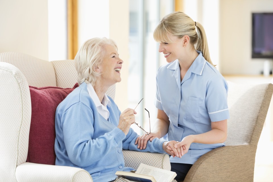 Caregiver talking with older woman