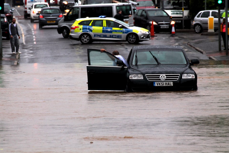  Police had to block off a road in Romford, Essex, but it was too late for one driver who tried his luck in the water