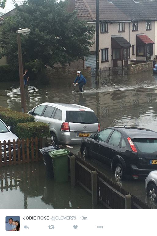  On your bike: A cyclist found himself in deep water in Essex this morning