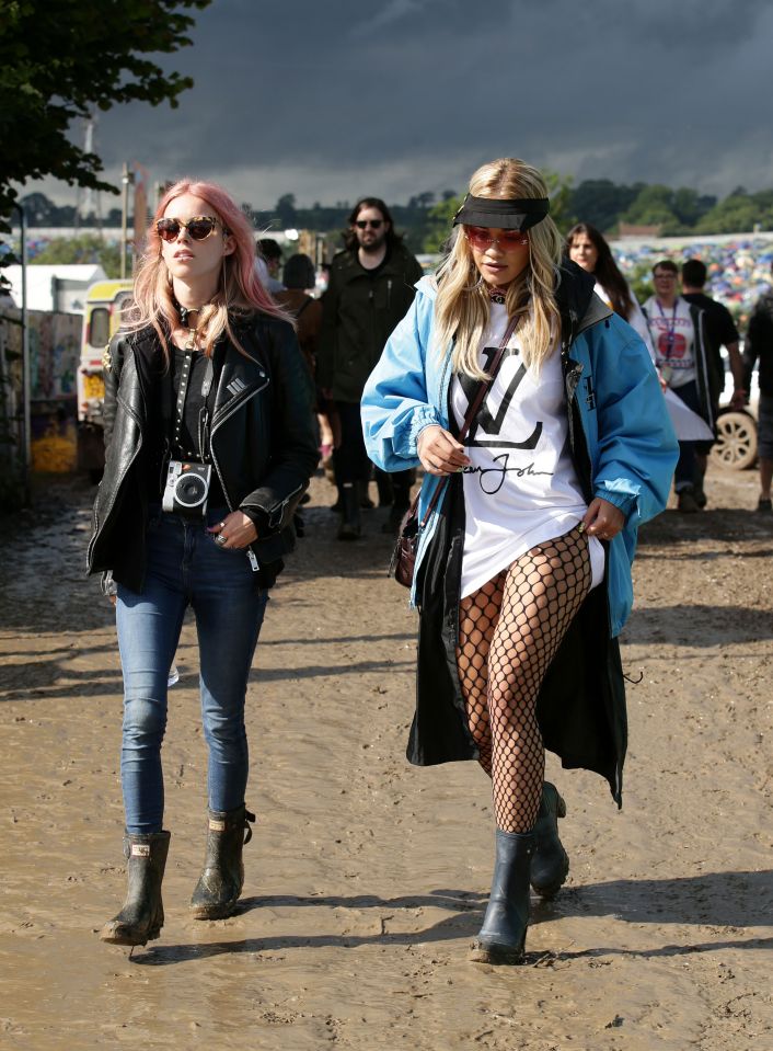  Rita was spotted with a pink-haired pal - yet Cara was nowhere to be seen