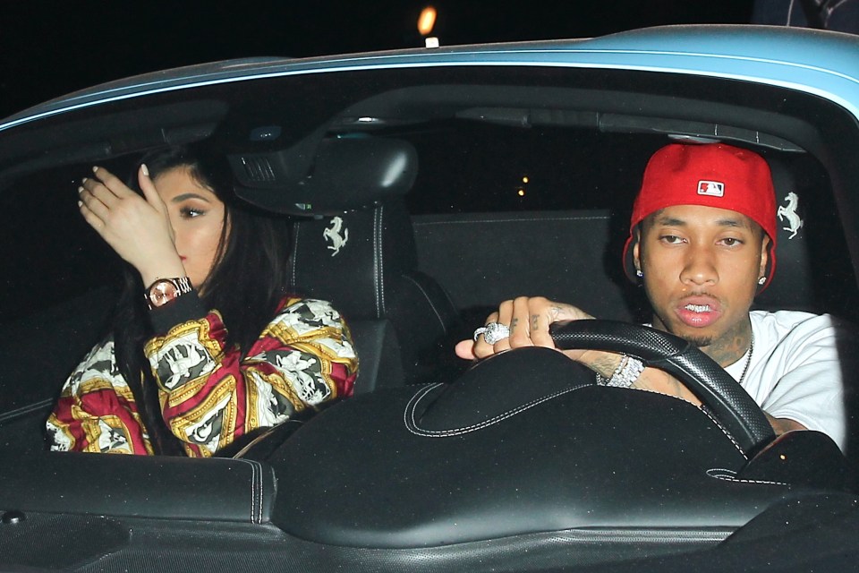  Tyga does not look happy that he has been caught with his 'ex'