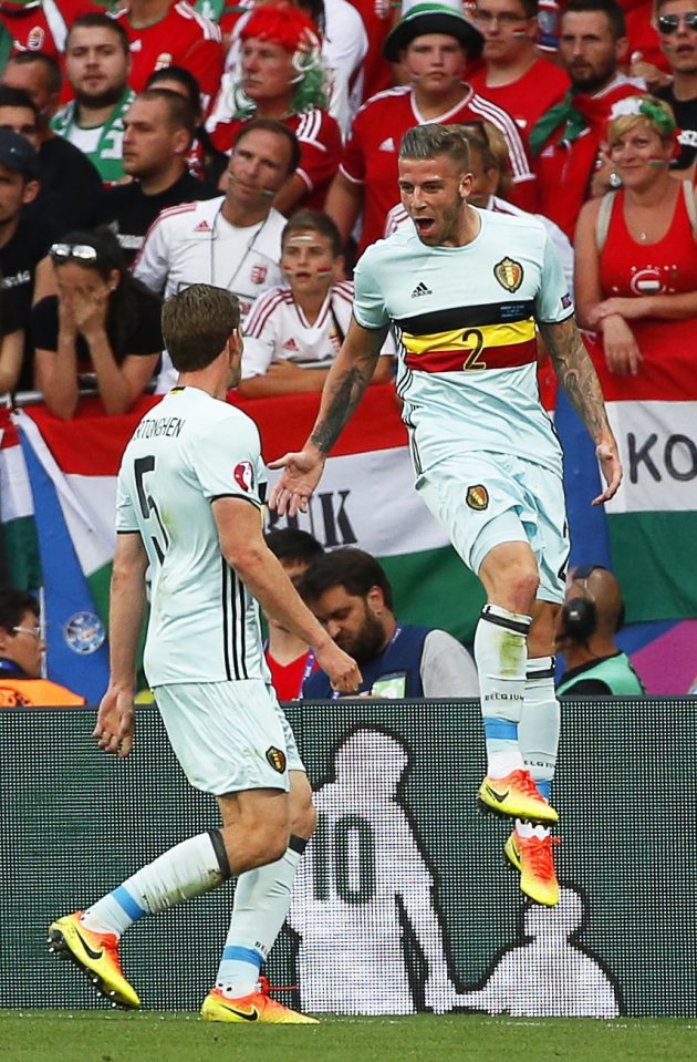 Alderweireld jumps for joy as he celebrates his goal with Tottenham team-mate Jan Vertonghen