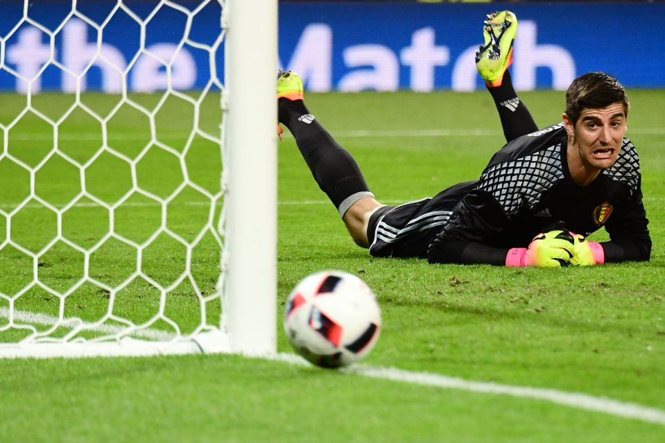 Belgium goalkeeper Thibaut Courtois watches the ball fly just wide of the post