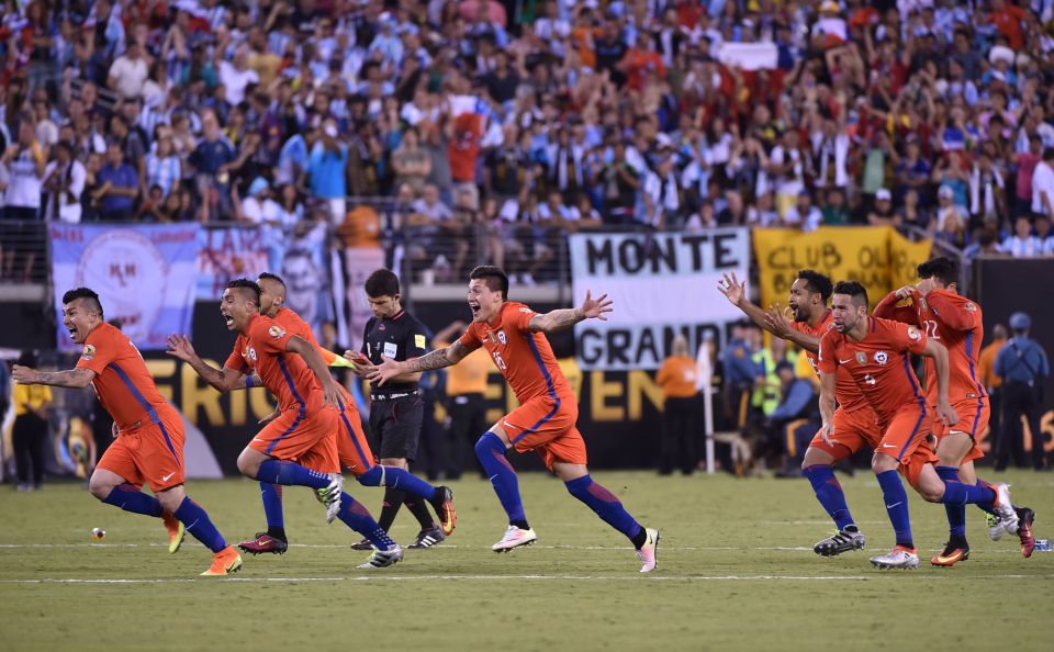  Chilean players run off to celebrate after retaining their Copa America crown