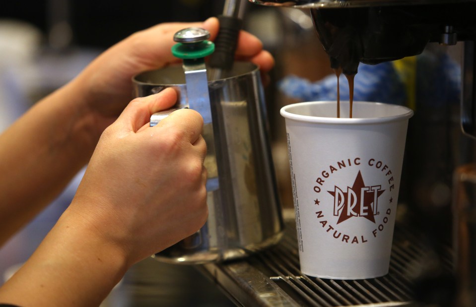 a person is pouring coffee into a cup that says organic coffee pret natural food