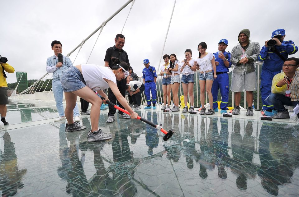 Here come the girls! A Chinese woman now has a turn at wielding the 5.5kg hammer