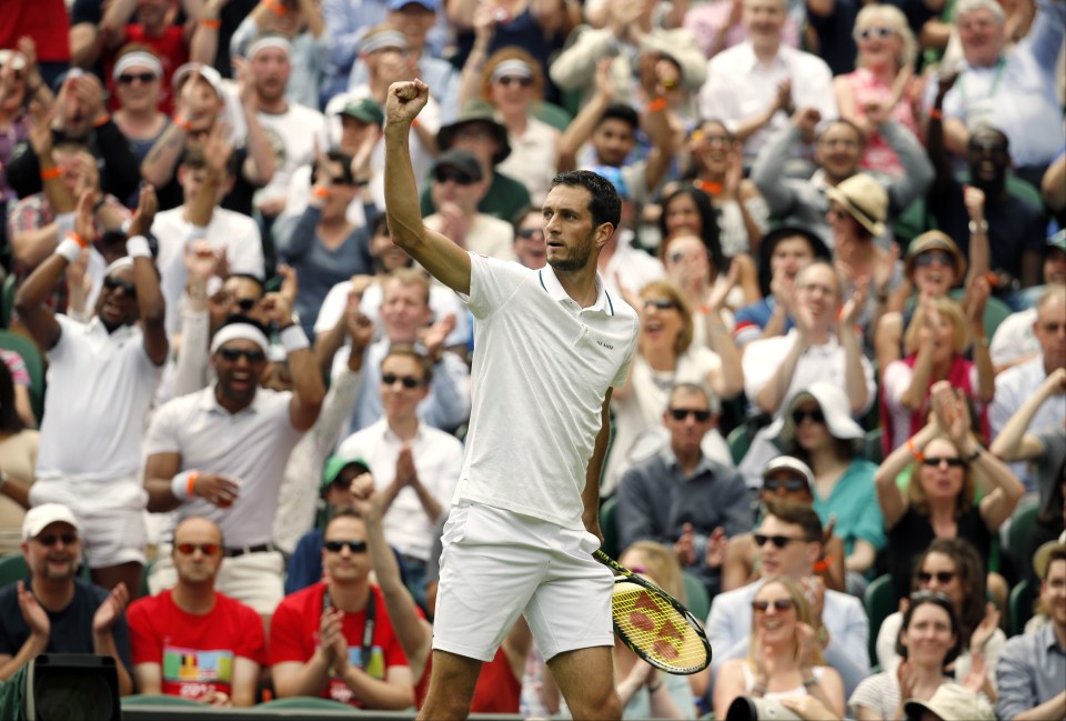 James Ward of Britain celebrates a point during his men's singles match against Novak Djokovic of Serbia on day one of the Wimbledon Tennis Championships in London, Monday, June 27, 2016. (AP Photo/Alastair Grant)