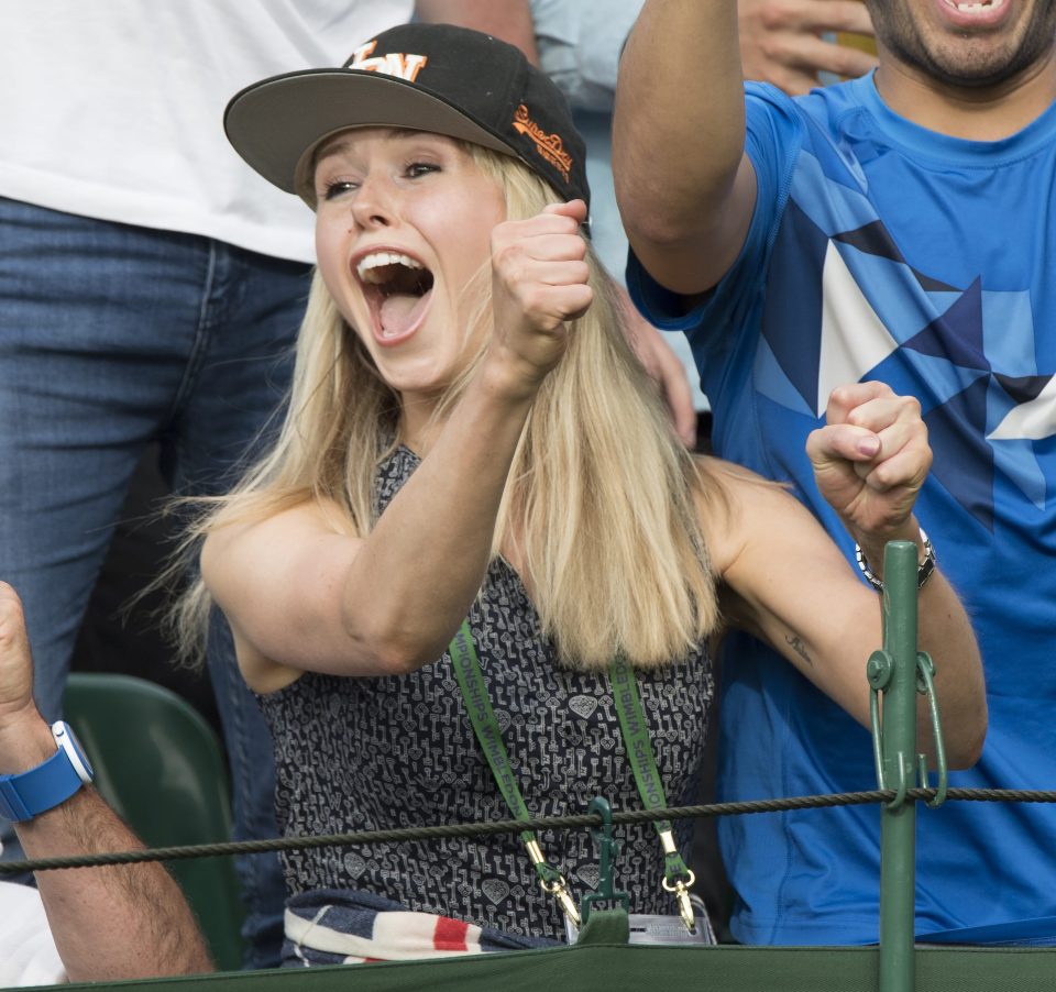  The model cheers on her boyfriend in his first-round match