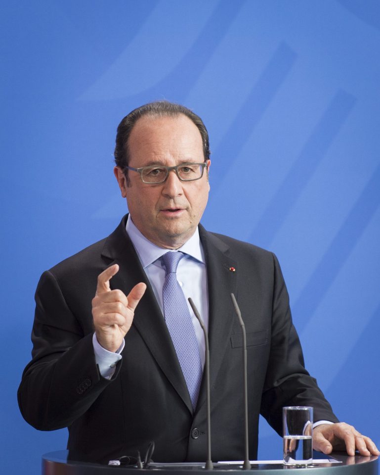  Flames of discontent ... French President Francois Hollande was also featured in the footage, with flames rising up around him