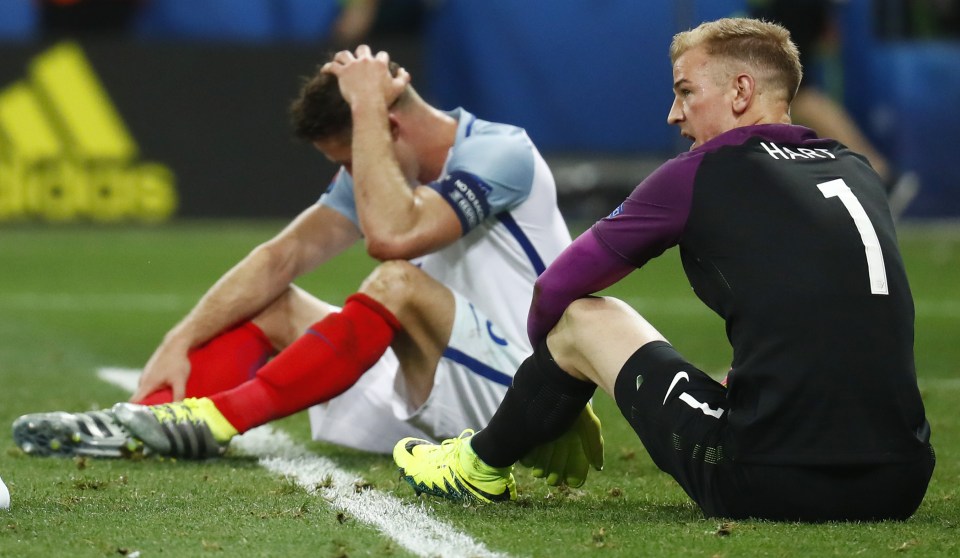 Gary Cahill and Joe Hart after the agonising defeat by Iceland