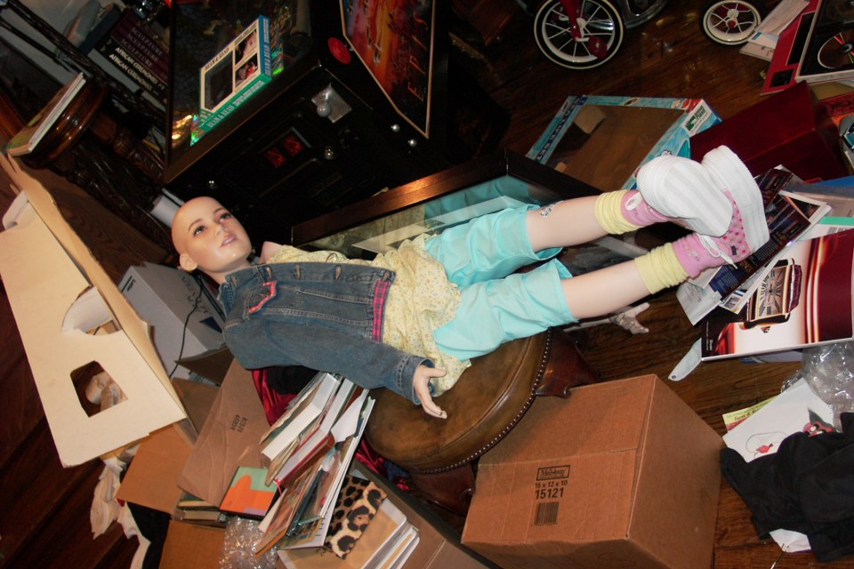  The mannequins were all fully clothed and posed in odd positions around the cluttered mansion