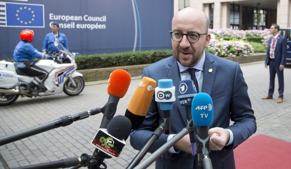  Belgian Prime Minister Charles Michel speaks with the media as he arrives for the EU summit