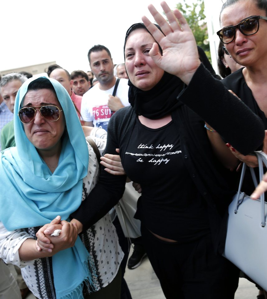  Relatives of Siddik Turgan, a custom officer at Ataturk Airport who was killed in the attacks