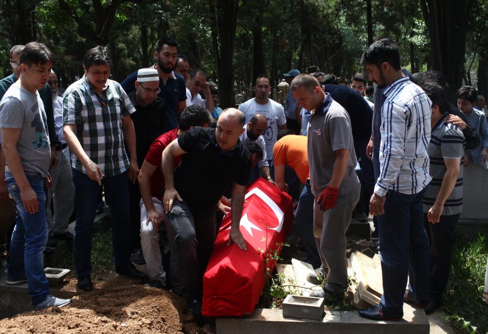  People bury the coffin of airport taxi driver Mustafa Biyikli, who lost his life in the following the suicide bomb attack in Istanbul Ataturk Airport