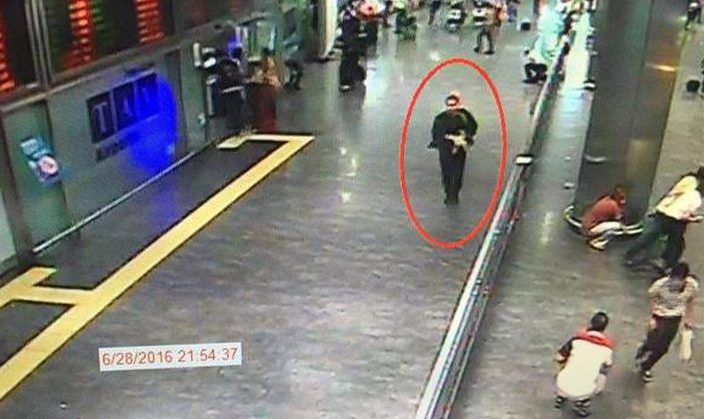  Other footage shows a man dressed all in black stalking the arrivals hall whle appearing to spray bullets at terrified passengers