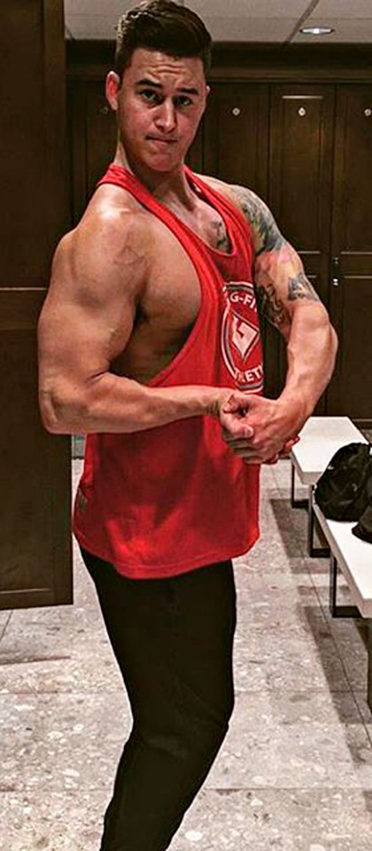  The bodybuilding champ pulls a pose after working on his fitness