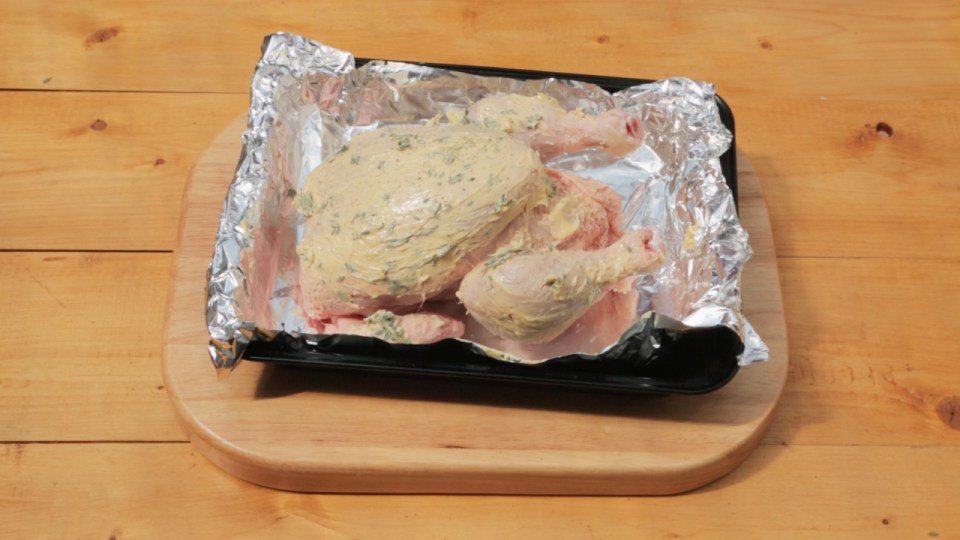  Cover chicken with butter and place lemon inside