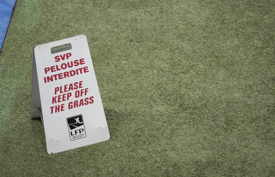 A sign on the newly-laid Stade Pierre-Mauroy pitch today