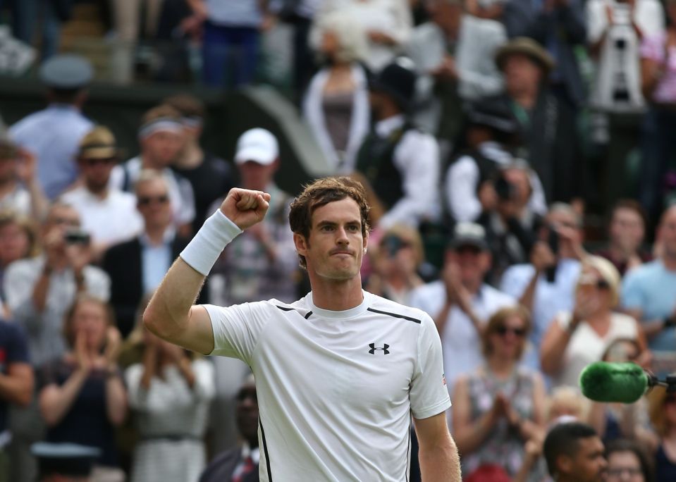  Andy Murray celebrates after winning his second round clash today