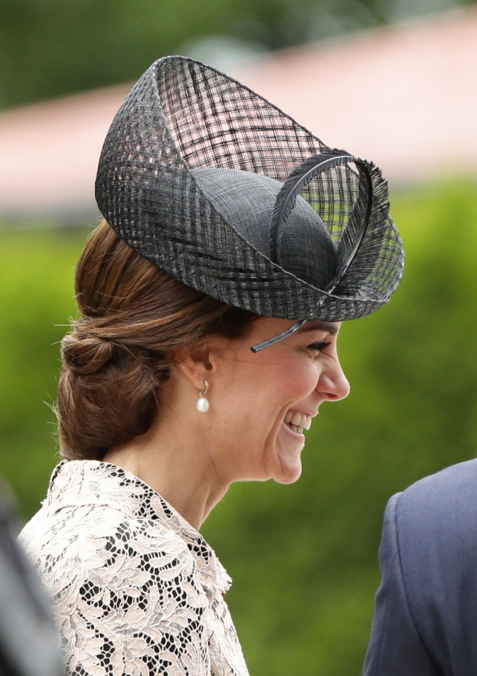  The Duchess of Cambridge looks beautiful as she shares a laugh with someone