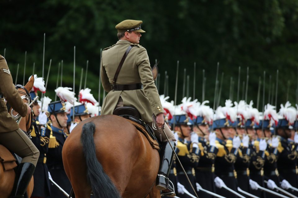  A soldier on horseback, dressed in World War I clothing, takes part in the ceremony