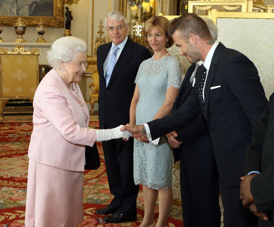 The Queen has met countless celebs, but she seems particularly excited about shaking hands with Mr Beckham