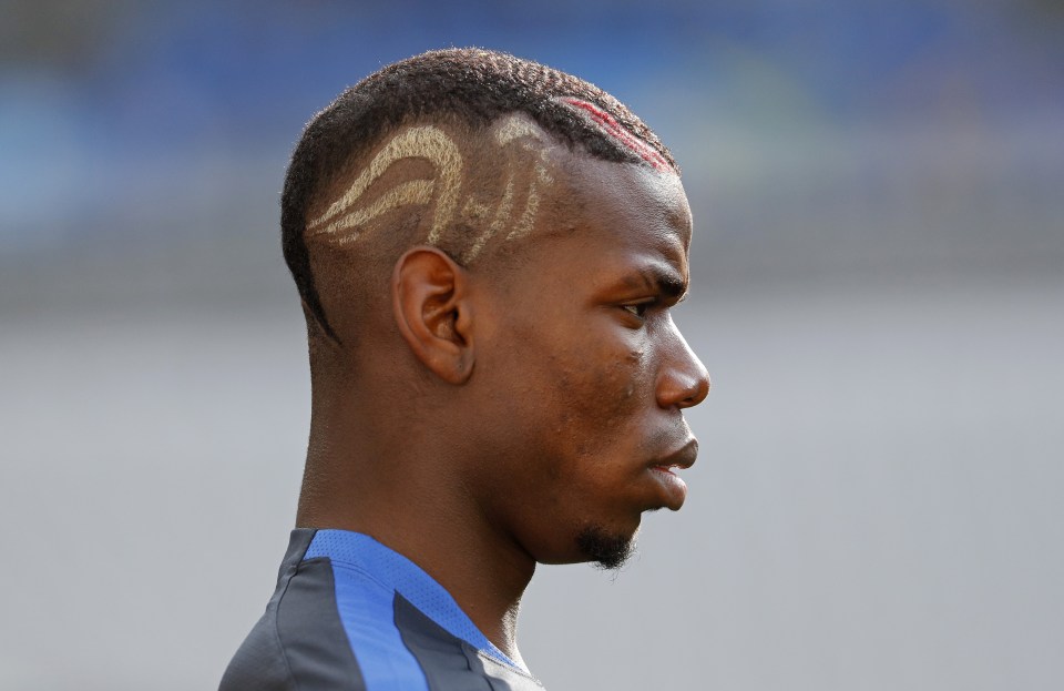  Paul Pogba sports his most recent hairstyle as France train ahead of Euro 2016