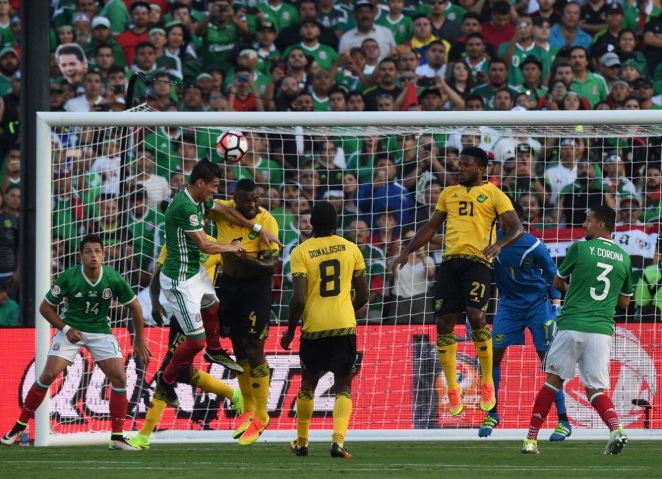 Mexico's Javier 'Chicharito' Hernandez (2-L) scores a header against Jamaica during their Copa America Centenario football tournament match in Pasadena, California, United States, on June 9, 2016. / AFP PHOTO / Mark RalstonMARK RALSTON/AFP/Getty Images