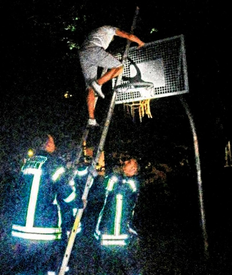  Firemen arrived to get Dozkun Idaetf down from the hoop using a ladder