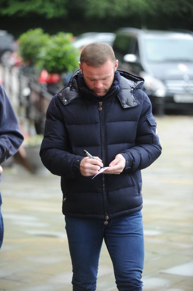 Wayne Rooney steps out in Manchester sporting a fuller head of hair than a month ago